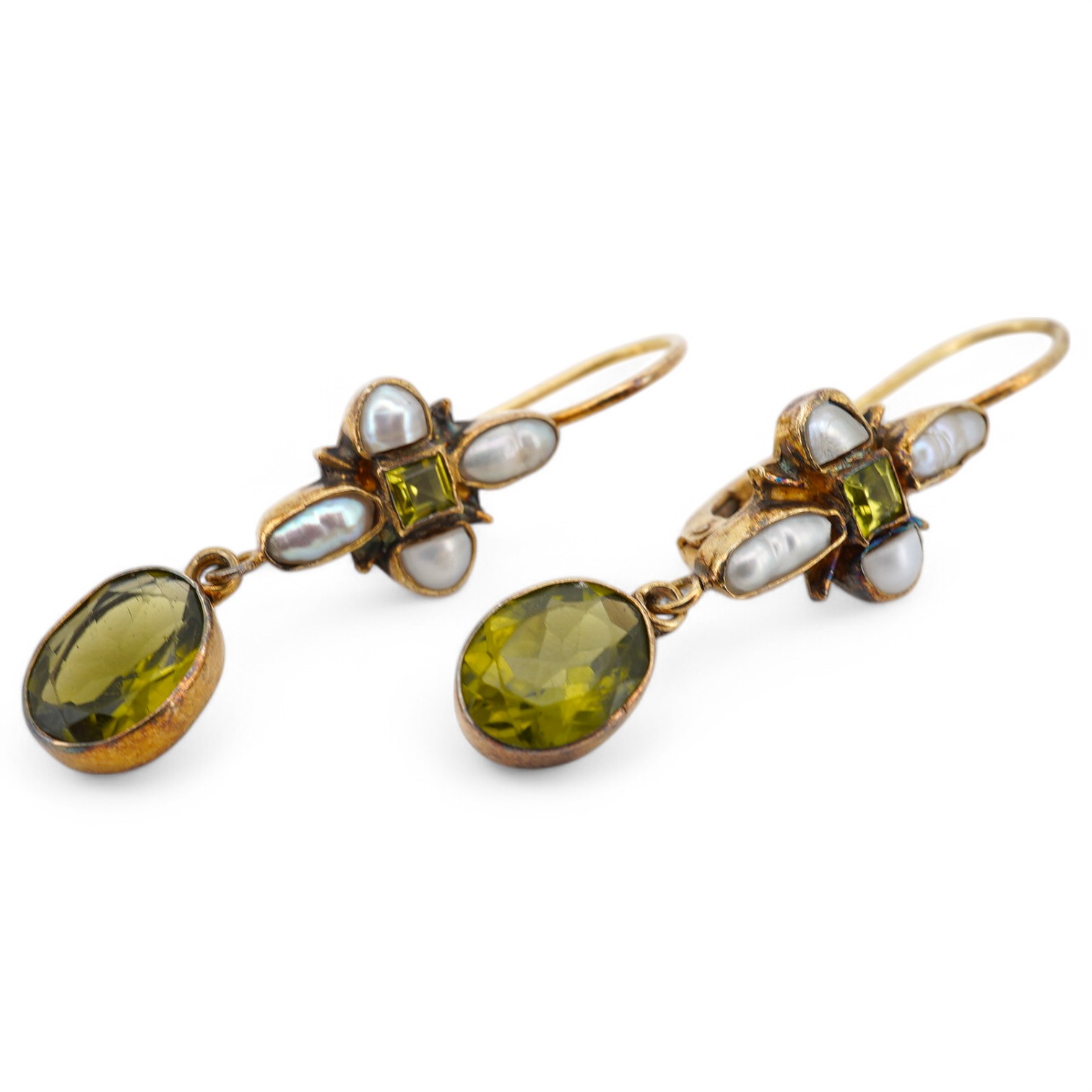 A pair of gilt white metal, peridot and baroque pearl cluster set drop earrings, 40mm. Condition - poor to fair